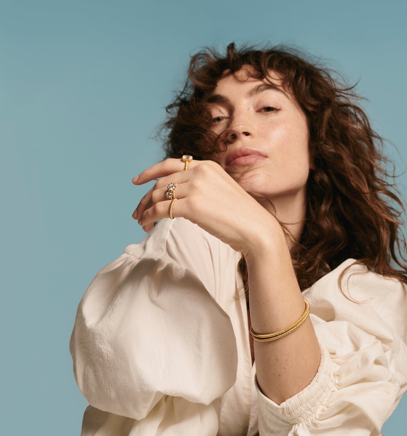 Woman wearing Oscar Massin beaded rings in white gold and lab grown diamonds